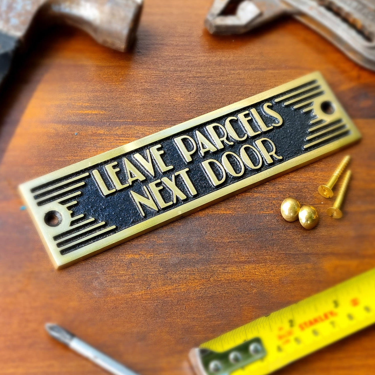 Art Deco 'Leave Parcels Next Door' Door Sign - The Metal Foundry